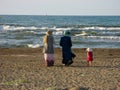 Muslim women hijab walking beach. Muslim women in hijab walking On the beach of the Caspian Sea in Iran, Anzali