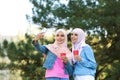 Muslim women in hijabs taking selfie