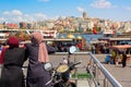 Muslim women looking Istanbul panorama with Galata tower during summer sunny day. Istanbul, Turkey.