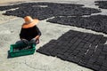 Muslim women put charcoal pack bar made from coconut shell on the floor Royalty Free Stock Photo