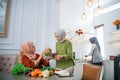 muslim woman serving drink for friend and family after fasting Royalty Free Stock Photo