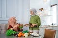 muslim woman serving drink for friend and family after fasting Royalty Free Stock Photo