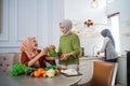 muslim woman serving drink for friend and family after fasting Royalty Free Stock Photo