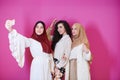 Muslim women taking selfie picture isolated on pink Royalty Free Stock Photo