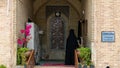 Muslim women in veils entering the mosque