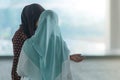 Muslim women wait for friends to travel together Royalty Free Stock Photo