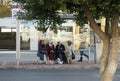 Muslim women waiting for a bus