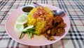 Muslim yellow rice with piece of beef