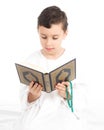 Muslim Young Boy Reading Quran And holding Rosary