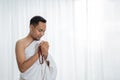 Muslim young man praying using tasbih Royalty Free Stock Photo