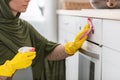 Muslim young woman cleaning dining table at kitchen Royalty Free Stock Photo