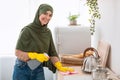 Muslim young woman cleaning dining table at kitchen Royalty Free Stock Photo