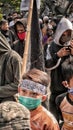 Muslim youths are in the midst of a crowd of Muslims holding Islamic flags parade in defense of Islamic religion