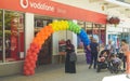 Muslima Standing under Rainbow Balloons Arch outside Vodafone Sh
