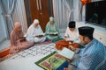 Muslims gather to read the Holy Al-Quran during recitation