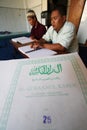 Muslims reading braille koran Quran