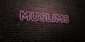 MUSLIMS -Realistic Neon Sign on Brick Wall background - 3D rendered royalty free stock image