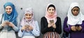 Muslin women hijab connecting communication technology togetherness Royalty Free Stock Photo