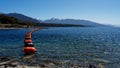 Mussel buoy barrier in front of the Control Gates that control the flow of water between Lake Te Anau and Lake Manapouri. These