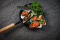 Mussel cooking pan seafood plate with Shellfish green mussels shell ocean gourmet dinner cooked Royalty Free Stock Photo