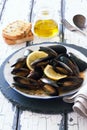 Mussels in copper pot preparing with thyme and lemon Royalty Free Stock Photo