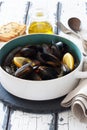 Mussels in copper pot preparing with thyme and lemon Royalty Free Stock Photo