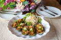 Mussels with feta cheese and spicy vegetables. Baked Mussels with Spicy Sauce. Garnished with Cherry Tomato and Salad Leaves. Spic Royalty Free Stock Photo