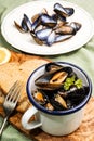 Mussels with garlic and butter sauce in a blue and white enamel Royalty Free Stock Photo