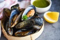 Mussels with herbs lemon on cook steamer food background - Fresh seafood shellfish in the restaurant mussel shell food on bamboo