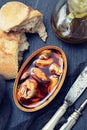 Mussels in sauce in iron box and bread Royalty Free Stock Photo