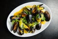 Mussels with sauce and greens