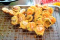 `mussels, shrimp, squid/octopus` in Takoyaki balls on metal grid Royalty Free Stock Photo