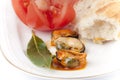 Mussels, tomato, bread and a bay leaf. Royalty Free Stock Photo