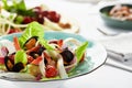 Mussels vongole in a plate with salad, mussels cooked in white wine sauce, on a party table, with white scart, salad Royalty Free Stock Photo