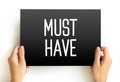 Must Have text on card, concept background Royalty Free Stock Photo