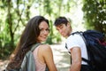 Must love hiking. a young couple hiking through the forest. Royalty Free Stock Photo