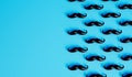 Mustache background. Lots of male mustaches on a blue background. 3D Rendering