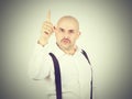 Mustache bald man shows finger up Royalty Free Stock Photo