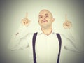 Mustache bald man shows finger up Royalty Free Stock Photo