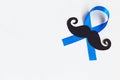 Mustache pattern with blue ribbon symbol. Movember concept. Royalty Free Stock Photo