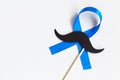 Mustache pattern with blue ribbon symbol. Movember concept.