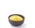Mustard in brown bowl isolated Royalty Free Stock Photo