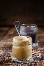 Mustard in a glass jar and seeds black and yellow mustard on an Royalty Free Stock Photo