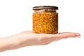 A mustard jar with grains female hand Royalty Free Stock Photo