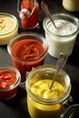 Mustard, ketchup, mayonnaise as dips in jars Royalty Free Stock Photo