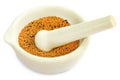 Mustard in a mortar with pestle Royalty Free Stock Photo