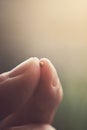 Mustard seed and fingertips. Royalty Free Stock Photo