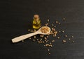 Mustard Seeds Essential Oil, Tincture or Extract in Small Bottle Royalty Free Stock Photo