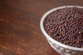 Mustard seeds in a Silver bowl on wooden old Table. Rustic Style Royalty Free Stock Photo