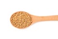 mustard seeds in wooden spoon isolated on white background. top view Royalty Free Stock Photo